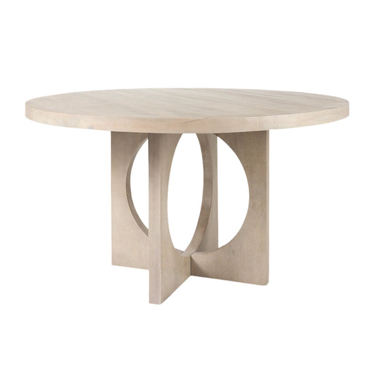Mercana Liesl circular top dining table with a sleek design and sturdy base, set against a neutral background.