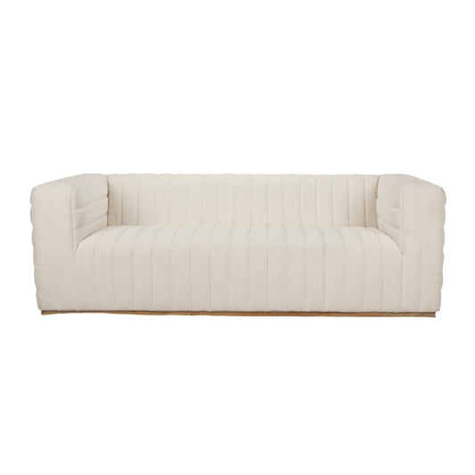 Mercana Ricciardo Cream Boucle 3-seater sofa with modern curved architectural design and plush fabric upholstery.