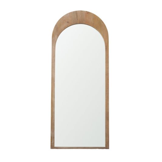 Mercana Celeste wood arched floor mirror with a tall, elegant wooden frame and curved top, standing on a sleek base.