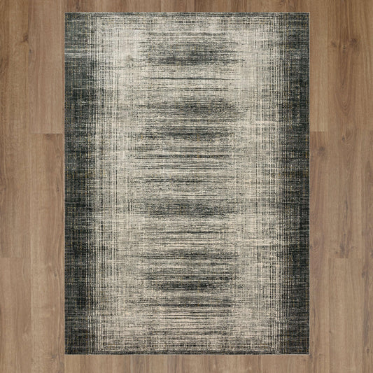 Alonzo Turin Anthracite Area Rug by Karastan, showcasing a modern design with a rich dark gray color and soft texture.