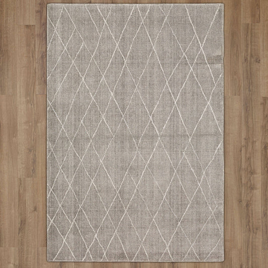Karastan Amato Deviation area rug in taupe, featuring a soft texture and elegant design, perfect for any room.