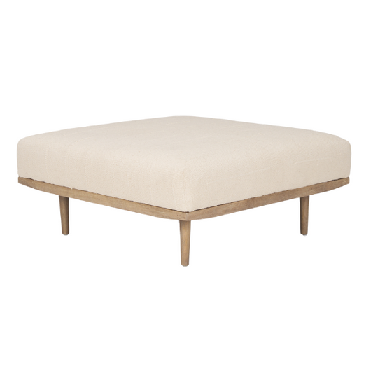 Modern Mercana Shae Ottoman with architectural fabric upholstery and wooden base, serving as a stylish footstool or accent piece.